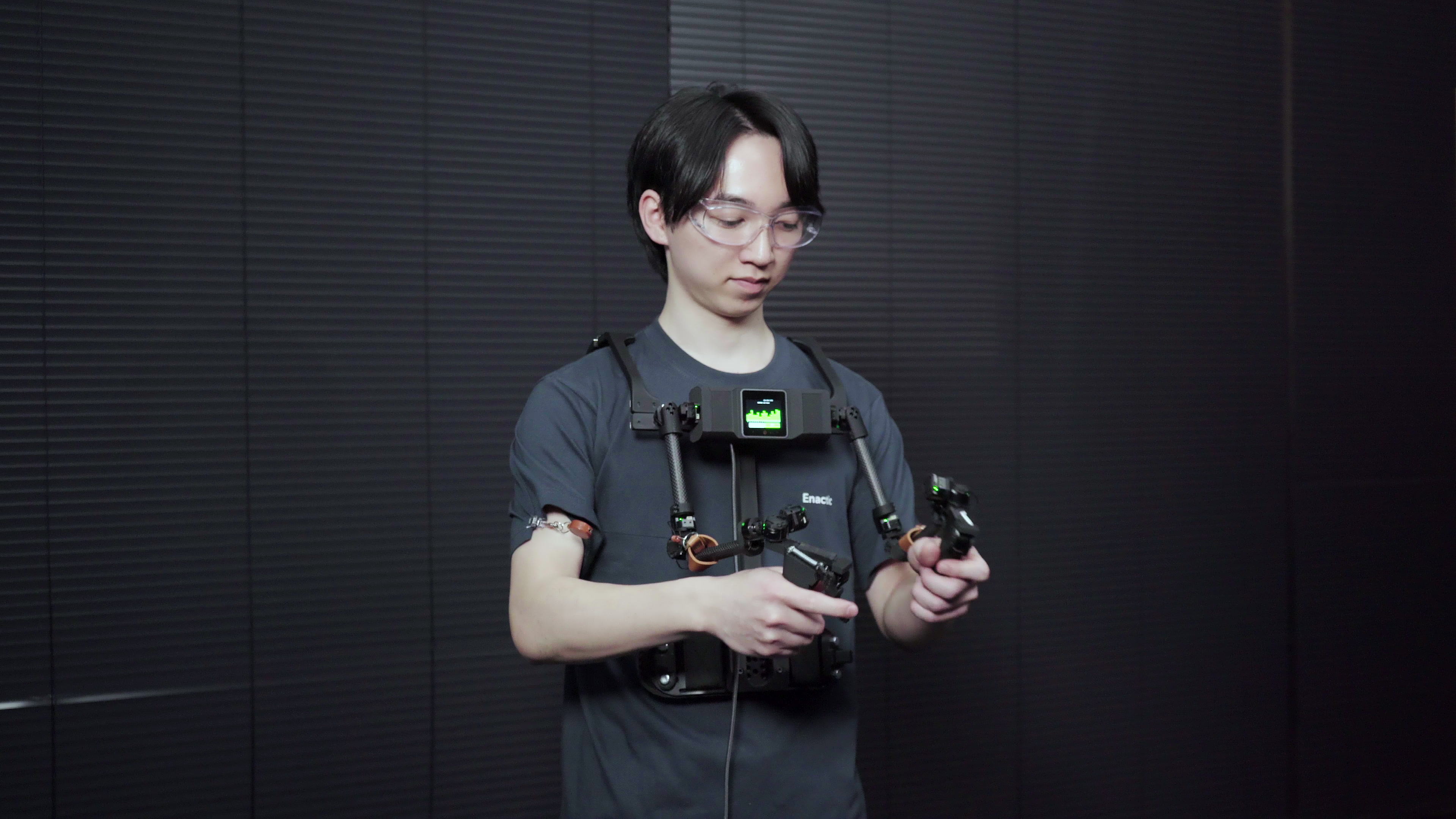 Operator demonstrating teleoperation with OpenArm KER
